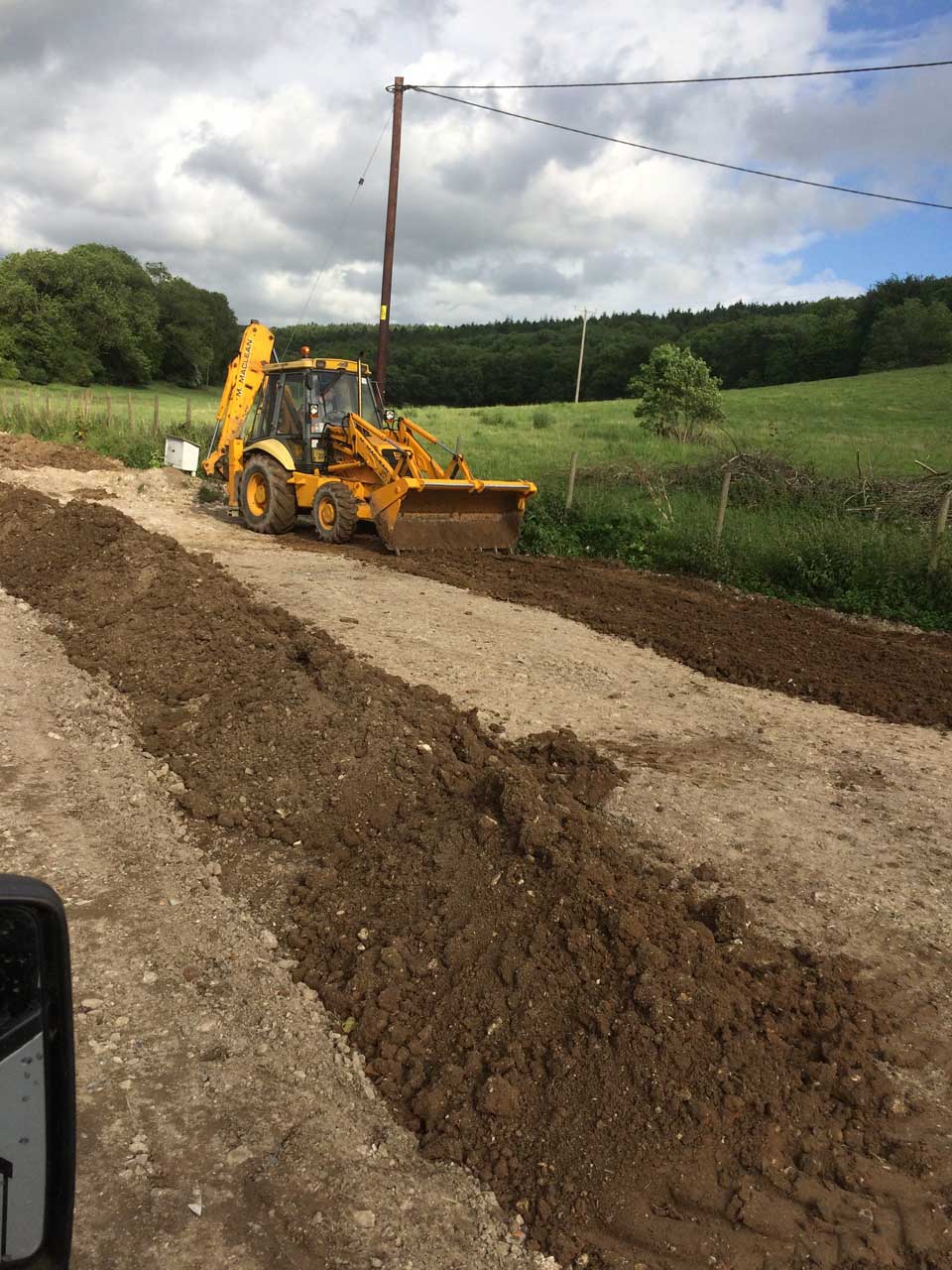 Excavation and Grading Berkshire Hampshire Surrey - digger hire with driver for grading and levelling in Berkshire Hampshire and Surrey