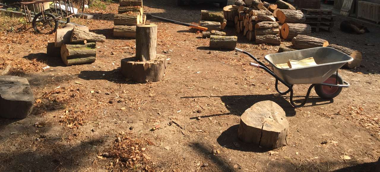 Seasoning firewood and storing firewood in Berkshire, splitting by axe